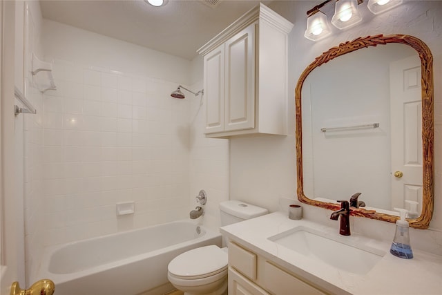 full bathroom featuring toilet, vanity, and tub / shower combination