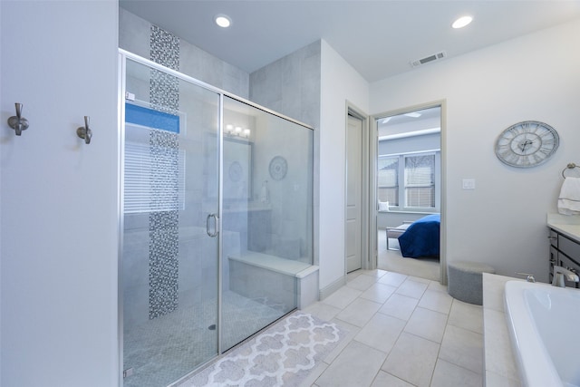 ensuite bathroom featuring visible vents, a bathing tub, connected bathroom, a shower stall, and tile patterned flooring