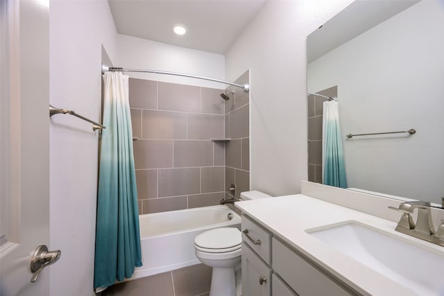 bathroom featuring shower / bath combo with shower curtain, vanity, and toilet