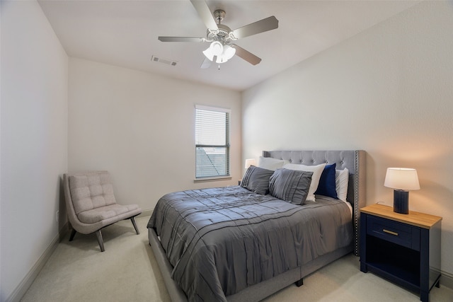 bedroom featuring light colored carpet, visible vents, ceiling fan, and baseboards