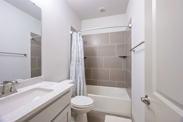 bathroom featuring toilet, tile patterned floors, shower / tub combo with curtain, and vanity