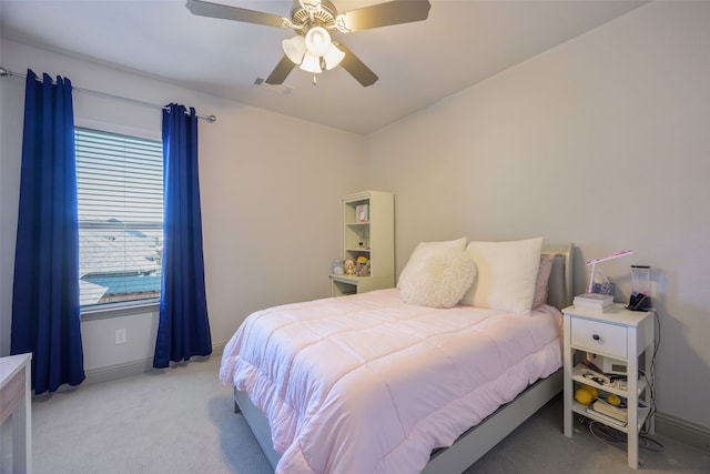 bedroom featuring visible vents, ceiling fan, light carpet, and baseboards