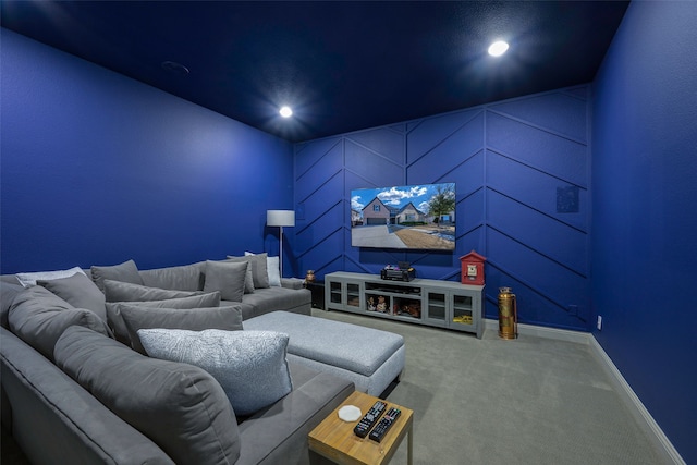 carpeted home theater room featuring baseboards and recessed lighting