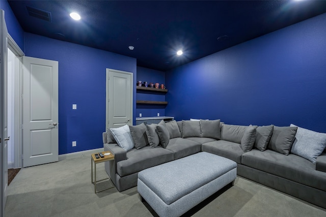 living area with baseboards, recessed lighting, visible vents, and light colored carpet