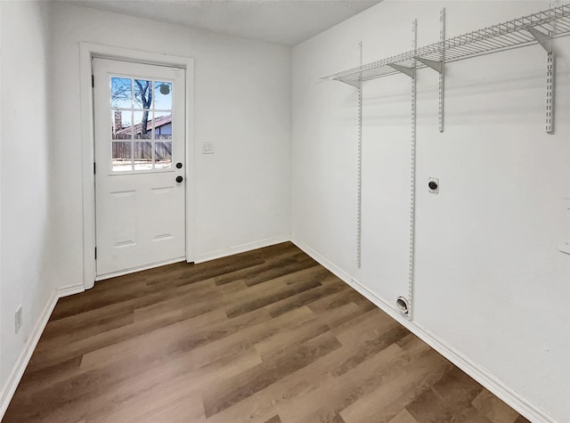 interior space with dark wood-style floors and baseboards