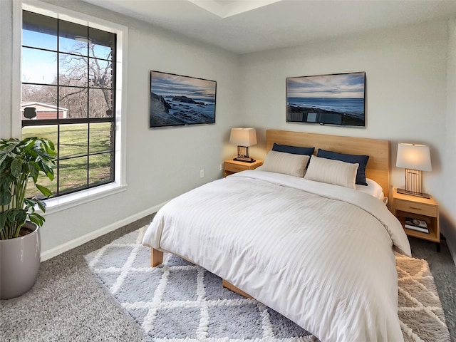 bedroom with carpet and baseboards