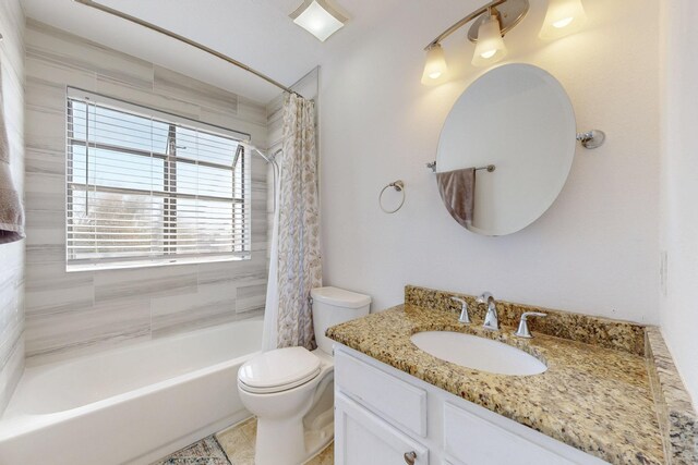 bathroom with vanity, shower / tub combo, and toilet