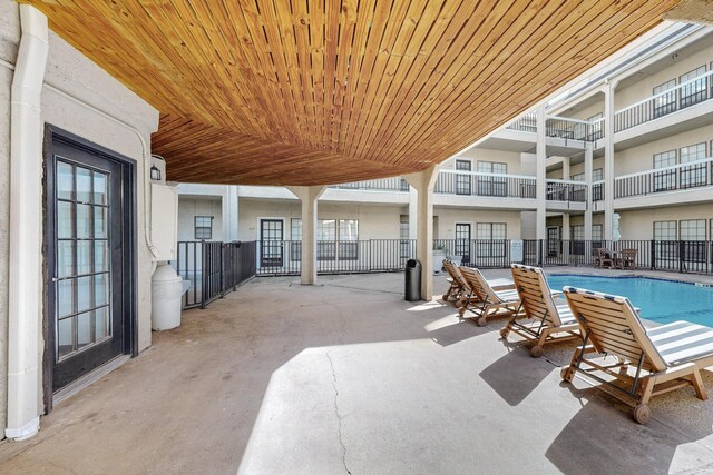 view of patio with a community pool