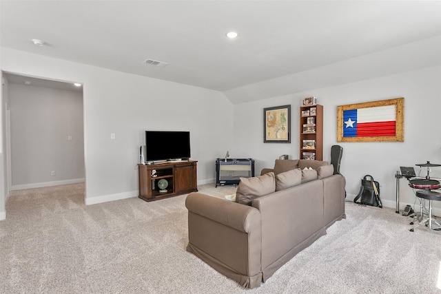 living room with vaulted ceiling, baseboards, visible vents, and light colored carpet