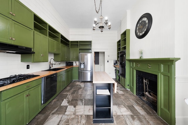 kitchen featuring a sink, green cabinets, butcher block counters, black appliances, and open shelves