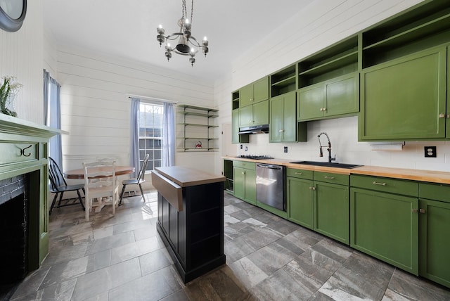 kitchen with open shelves, wood counters, a sink, stainless steel appliances, and green cabinetry