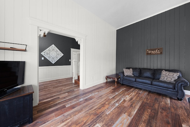 living area featuring lofted ceiling and wood finished floors