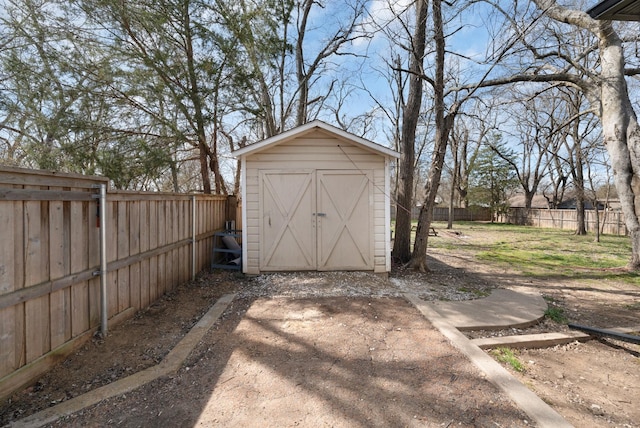 view of shed featuring a fenced backyard