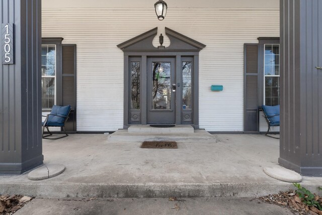 view of side of home with central AC unit