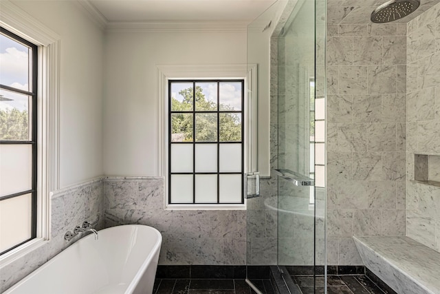 full bathroom with a stall shower, a soaking tub, tile walls, and crown molding