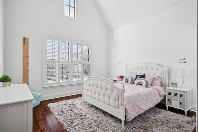 bedroom with high vaulted ceiling, dark wood-type flooring, and baseboards