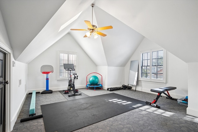 exercise room featuring a ceiling fan, lofted ceiling, carpet, and baseboards