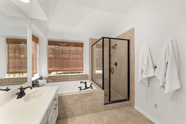 bathroom with a stall shower, a garden tub, vanity, and tile patterned floors