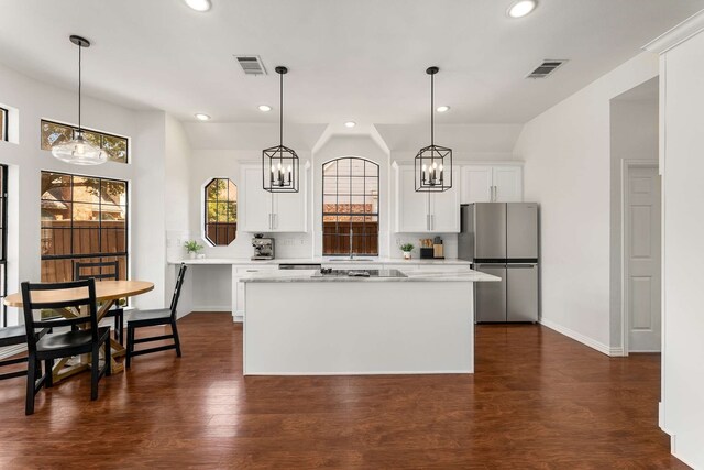 living room featuring ceiling fan, a fireplace, wood finished floors, visible vents, and ornamental molding