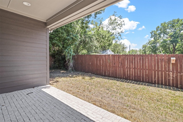 view of yard with a fenced backyard