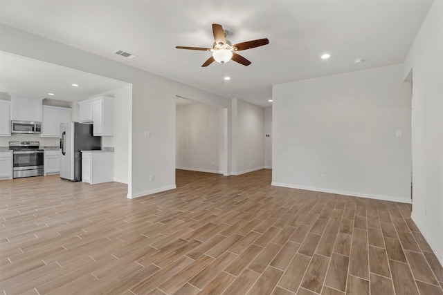 unfurnished living room with recessed lighting and light wood-style floors