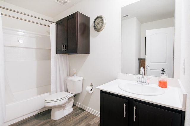 full bathroom with visible vents, vanity, toilet, and wood finished floors