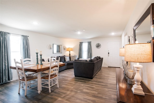 living area with dark wood finished floors and recessed lighting