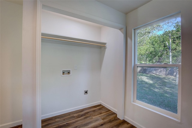 washroom with hookup for a washing machine, hookup for an electric dryer, wood finished floors, laundry area, and baseboards