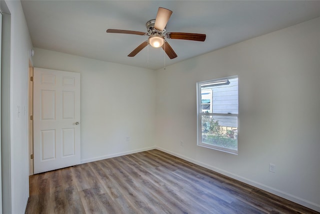 unfurnished room featuring ceiling fan, baseboards, and wood finished floors