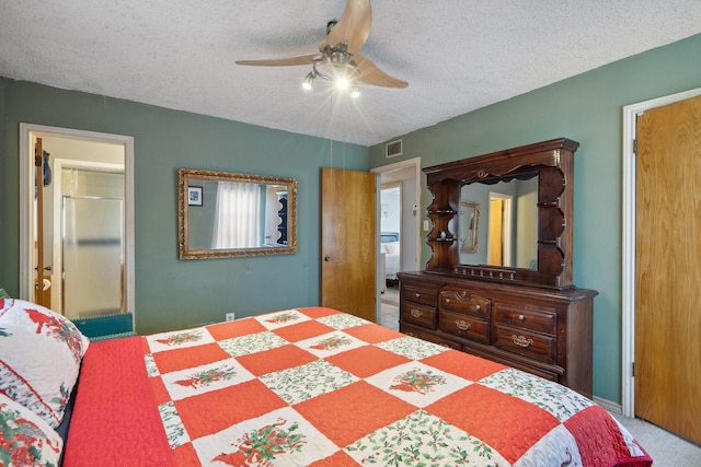 bedroom featuring carpet floors, visible vents, a textured ceiling, and a ceiling fan