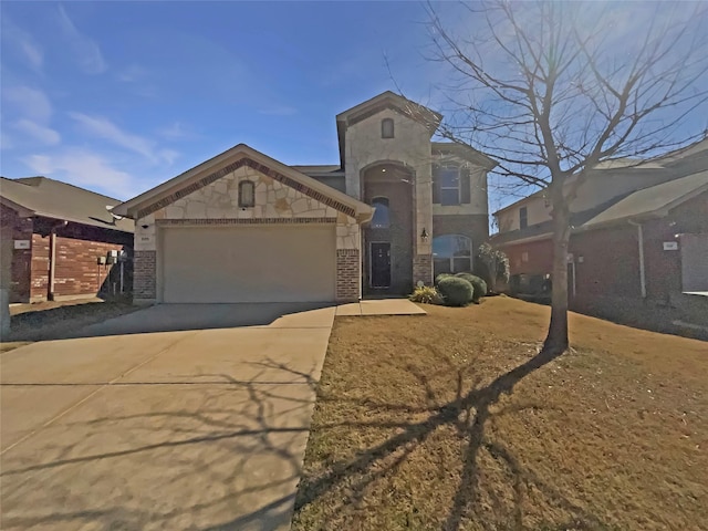 view of front of house featuring an attached garage, stone siding, and concrete driveway