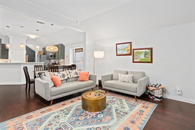 living area featuring lofted ceiling, dark wood-style floors, visible vents, and baseboards