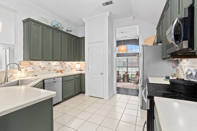 kitchen with visible vents, a sink, appliances with stainless steel finishes, green cabinets, and light tile patterned floors