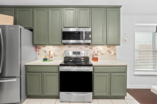 kitchen featuring green cabinetry and stainless steel appliances