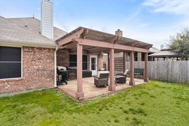 view of patio featuring area for grilling, a pergola, and fence