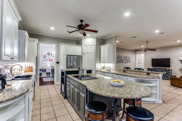 kitchen with light tile patterned floors, a sink, white cabinets, stainless steel refrigerator with ice dispenser, and open shelves