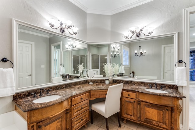 bathroom featuring double vanity, crown molding, a sink, and a shower stall