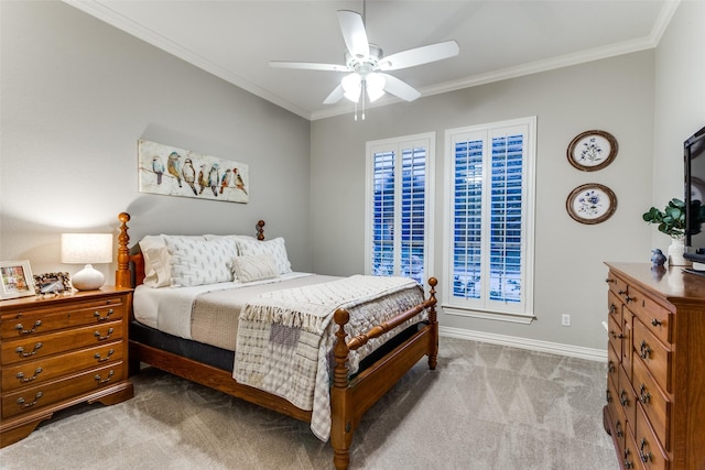 carpeted bedroom with baseboards, ornamental molding, and ceiling fan