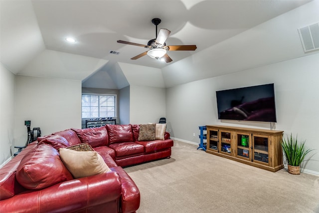 carpeted living area with lofted ceiling, baseboards, visible vents, and ceiling fan