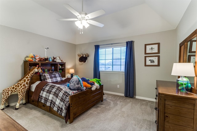 bedroom featuring light carpet, baseboards, a ceiling fan, and lofted ceiling