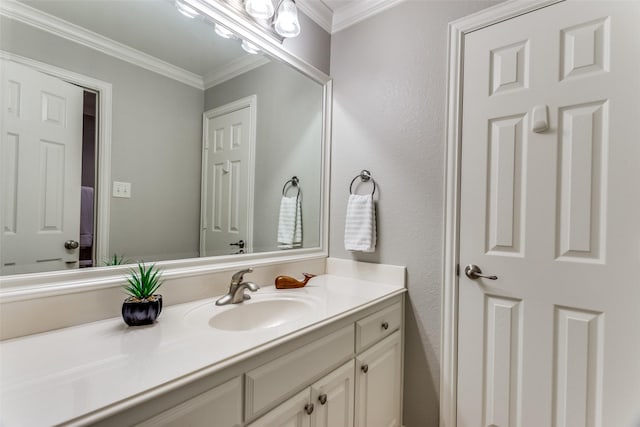 bathroom with vanity and crown molding