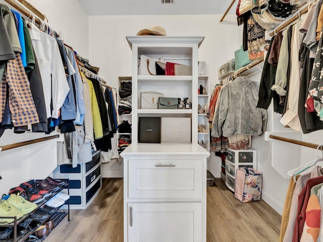 walk in closet featuring light wood finished floors and visible vents