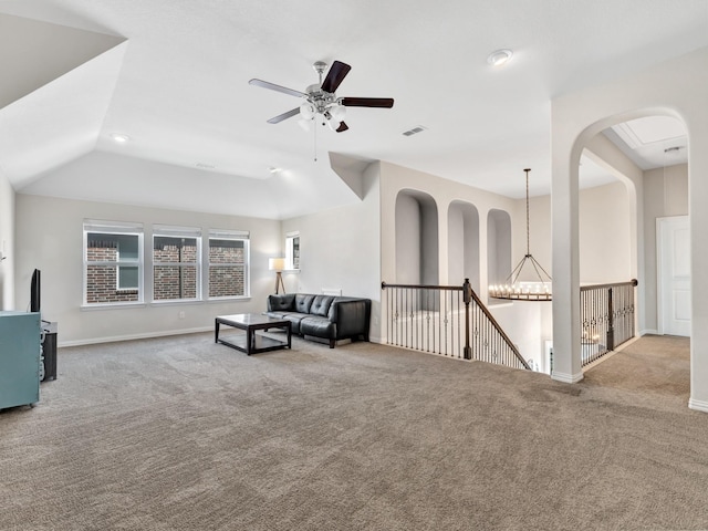 interior space with carpet, baseboards, visible vents, and an upstairs landing