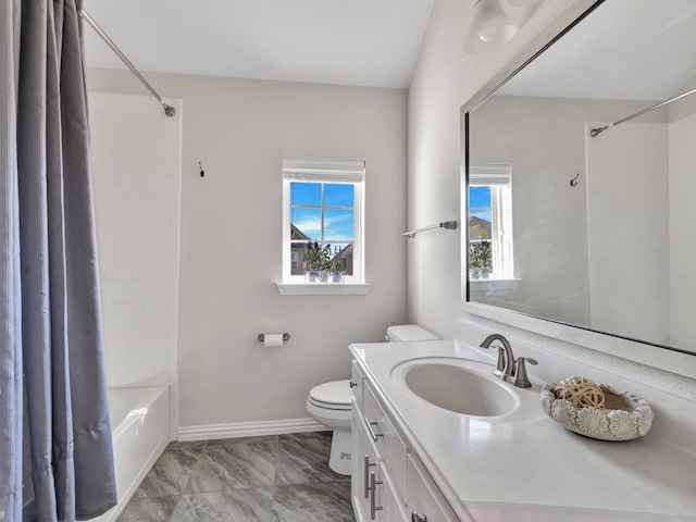 full bath featuring marble finish floor, shower / bath combination with curtain, toilet, vanity, and baseboards