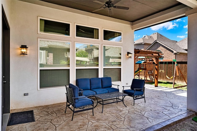 view of patio featuring ceiling fan, fence, an outdoor hangout area, and a playground