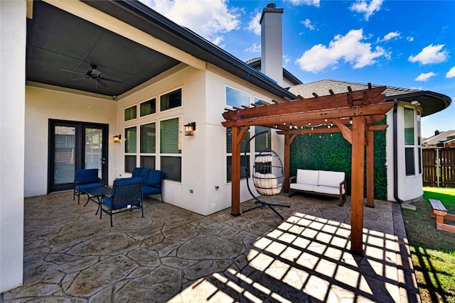 view of patio with outdoor lounge area, fence, a ceiling fan, and a pergola