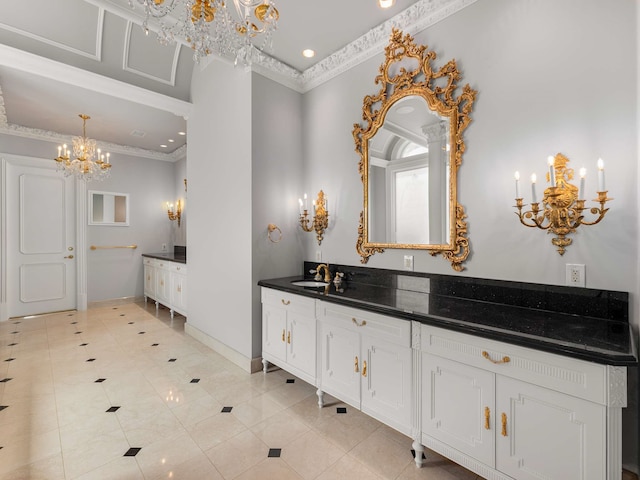 bathroom featuring an inviting chandelier, crown molding, tile patterned flooring, baseboards, and vanity