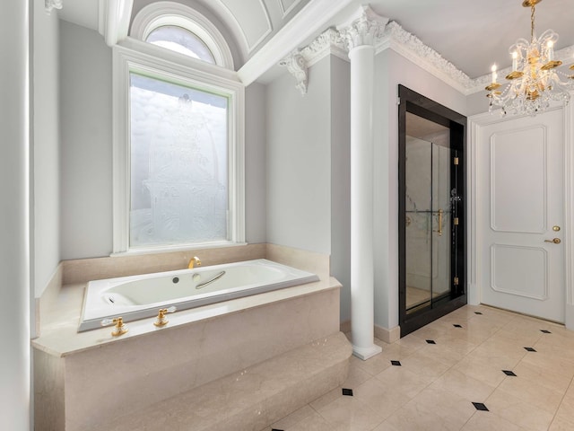 bathroom with tile patterned flooring, a notable chandelier, a shower stall, and a garden tub