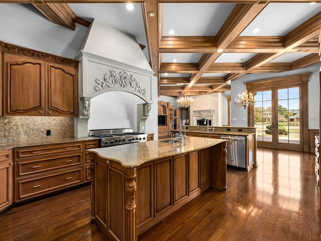 kitchen featuring beam ceiling, a sink, an inviting chandelier, gas range, and dishwasher