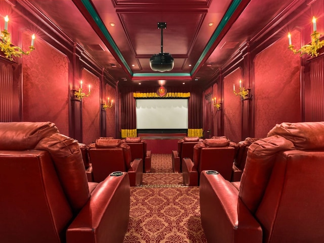 carpeted cinema room featuring ornamental molding